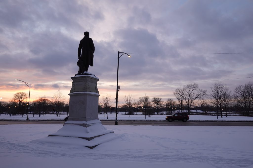 Alexander von Humboldt statue in sunset